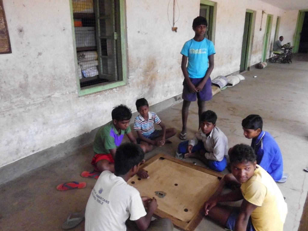 Small and not so slam enjoying the game of carom